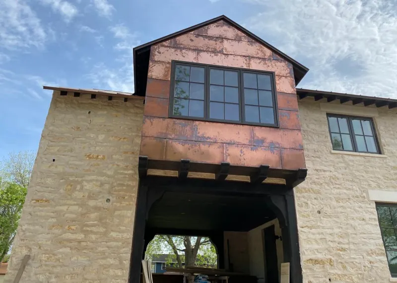 Copper metal panel facade on a stone building for Metal Roof Coating in Santa Ana