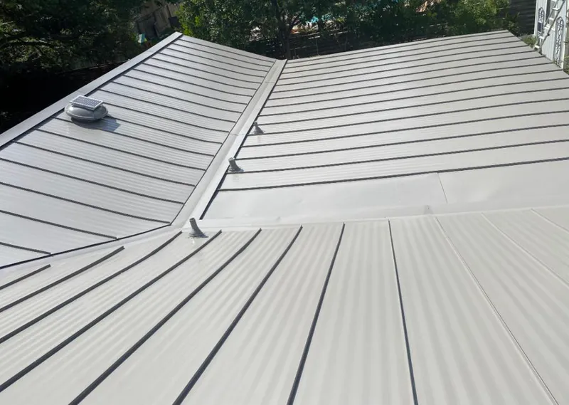 Solar attic fan installed on a metal roof for Roof Ventilation in Santa Ana
